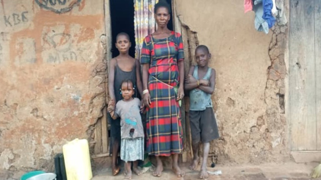 A child smiling during an Africa Family Rescue family visit in Uganda.